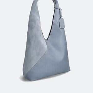 Elegant Blue Hobo Bag with Modern Design